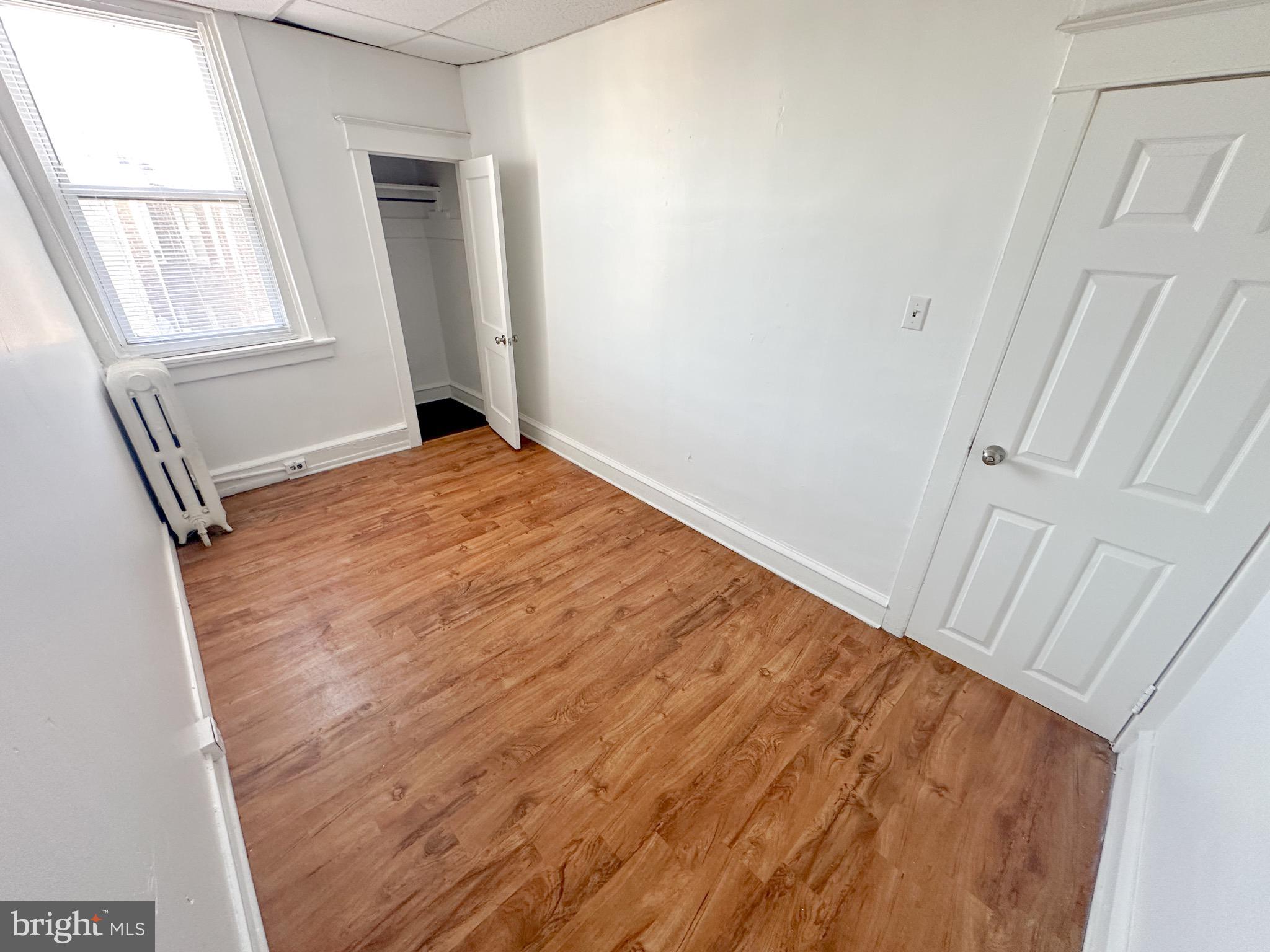 4507 North Reese Street Philadelphia, PA 19140 - Photo 17 of 23 a view of empty room with wooden floor and fan