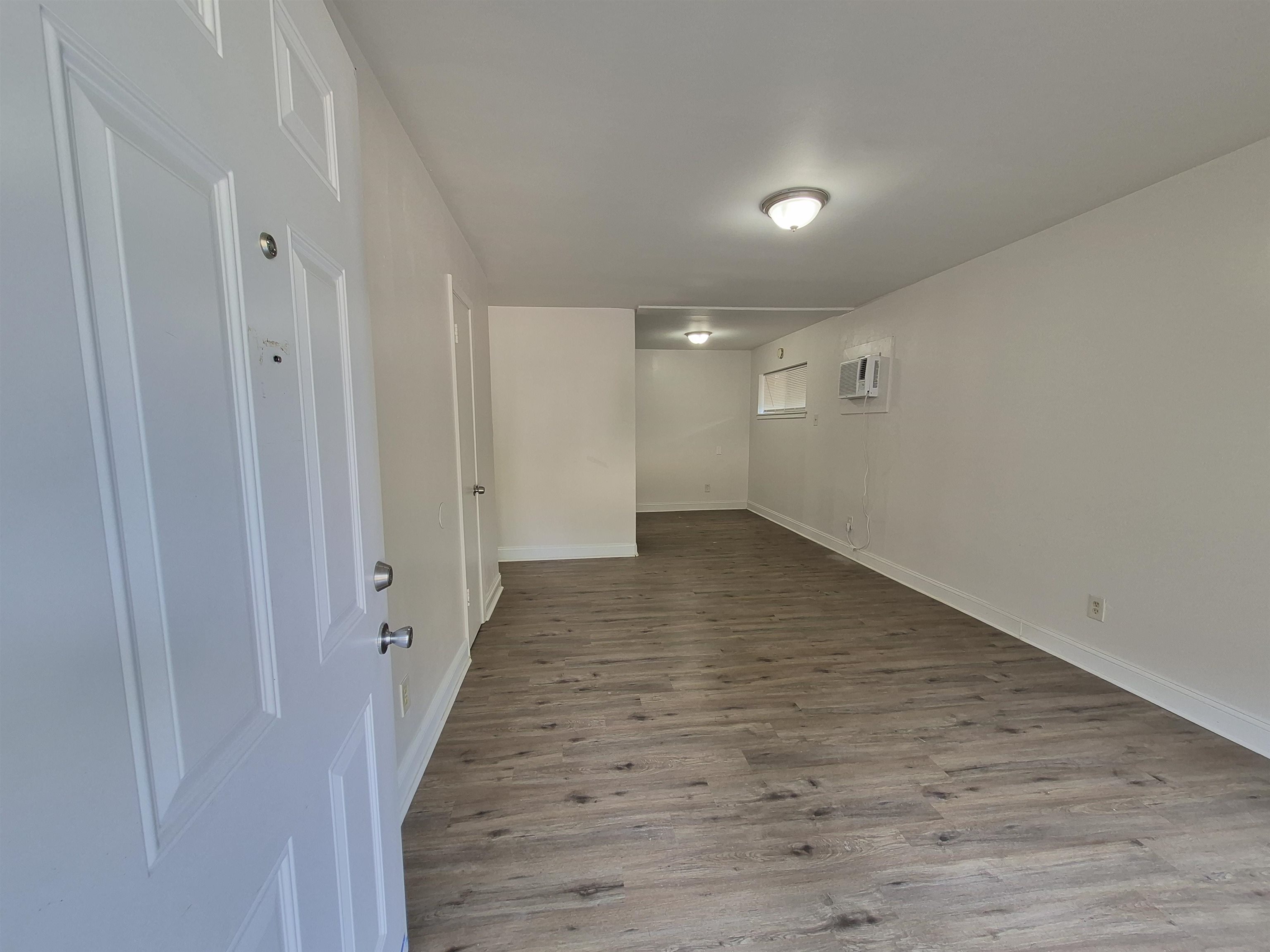 3449 Tutwiler Avenue, Unit 3449 Memphis, TN 38122 - Photo 2 of 10 a view of a hallway with wooden floor