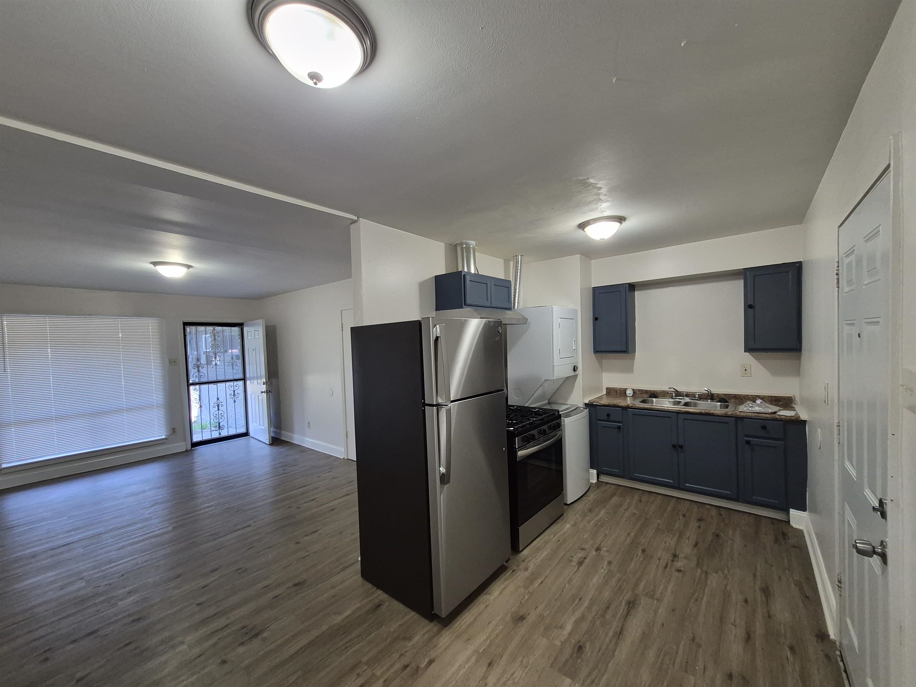 3449 Tutwiler Avenue, Unit 3449 Memphis, TN 38122 - Photo 10 of 10 a kitchen with stainless steel appliances granite countertop a refrigerator stove top oven and sink