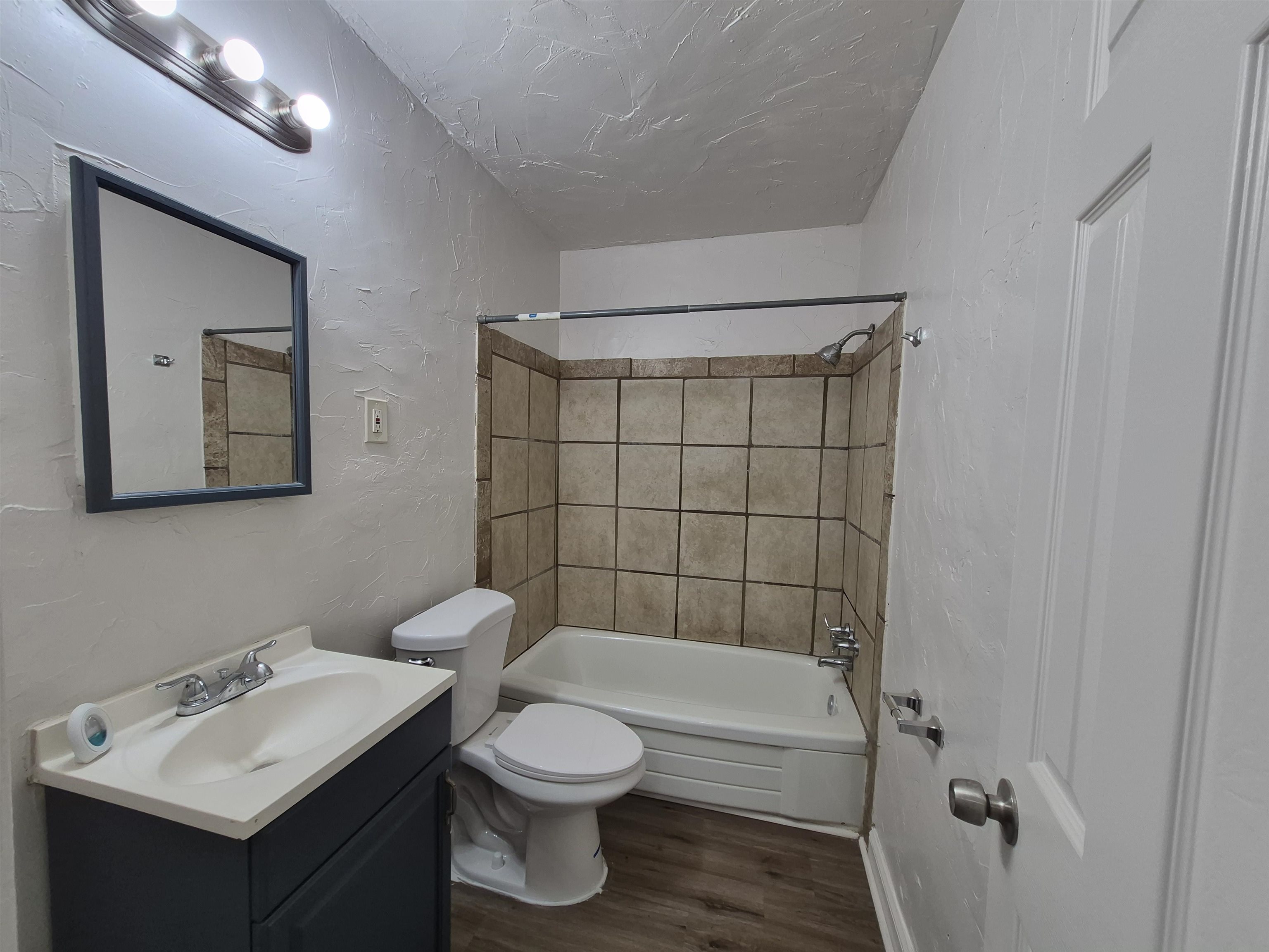 3449 Tutwiler Avenue, Unit 3449 Memphis, TN 38122 - Photo 6 of 10 a bathroom with a toilet sink and shower