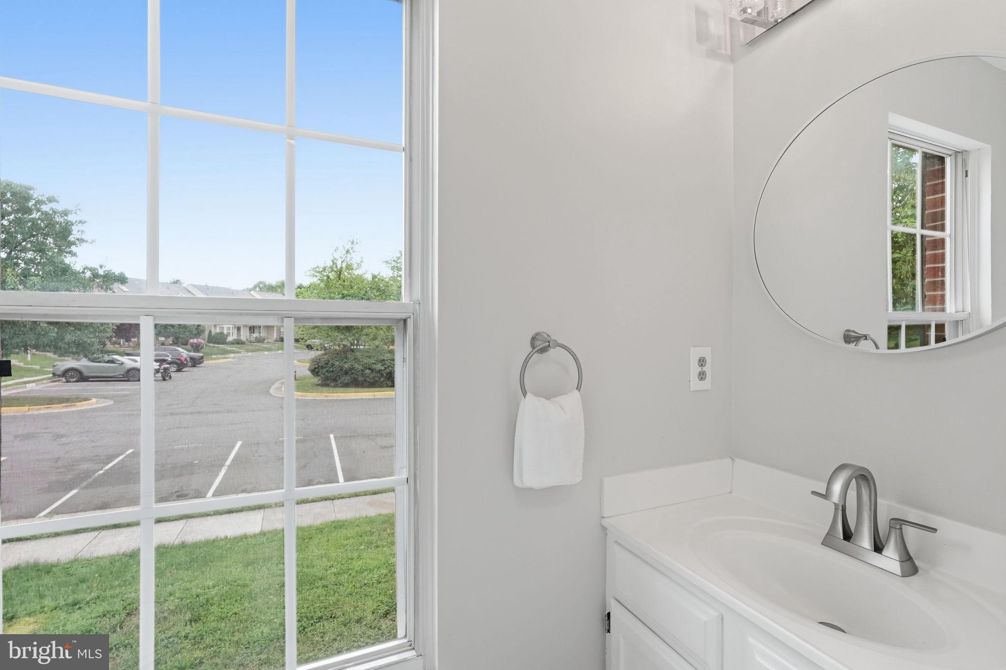 6010 Bingley Road Alexandria, VA 22315 - Photo 18 of 50 a bathroom with a sink and a mirror