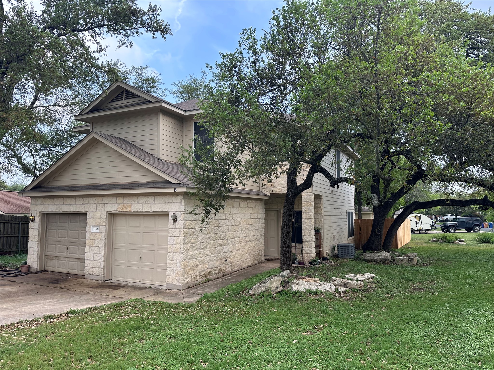12307 Abney Drive Austin, TX 78729 - Photo 17 of 18 front view of house with a yard