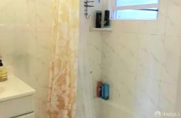 a bathroom with a shower curtain