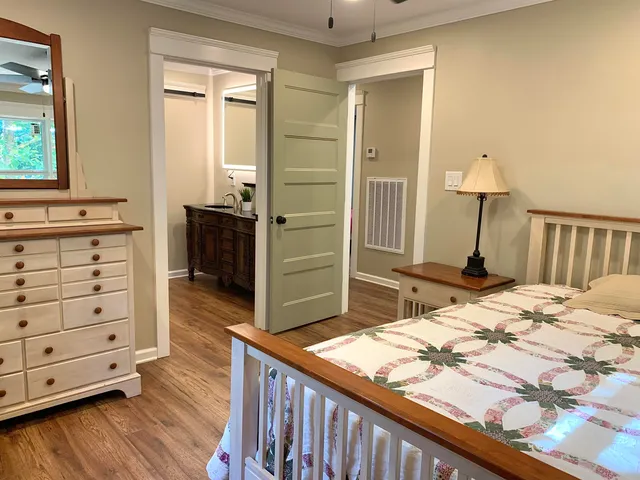 a bedroom with a bed and a dresser