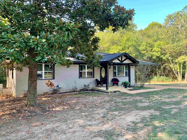 a front view of a house with yard