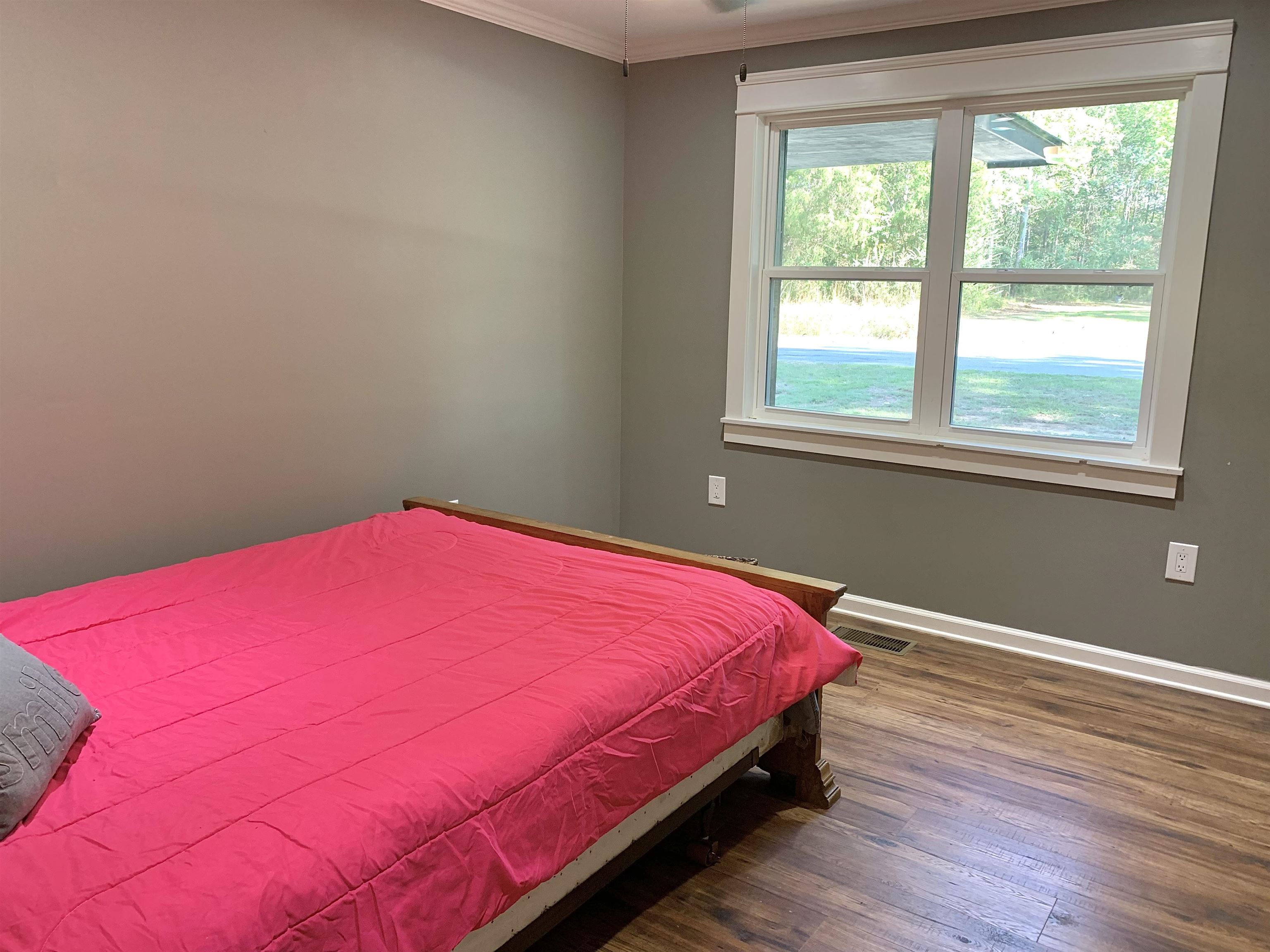 17 Cr 747 Road Walnut, MS 38683 - Photo 21 of 35 a bedroom with a bed and a window