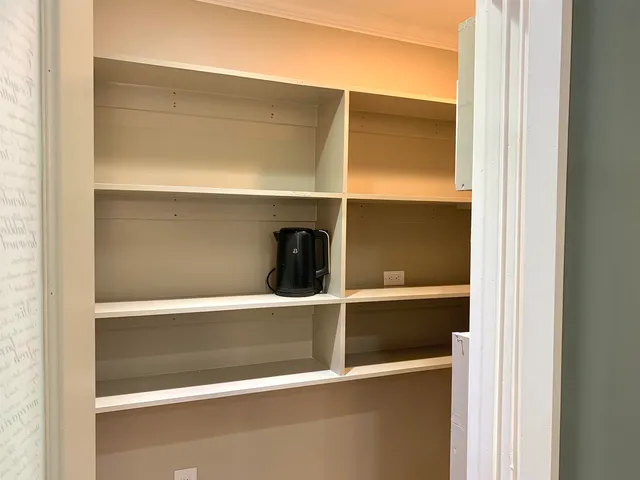 a room with storage and utility