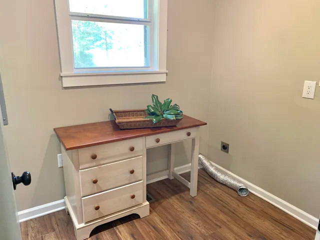 a view of a chairs and table on the wooden deck