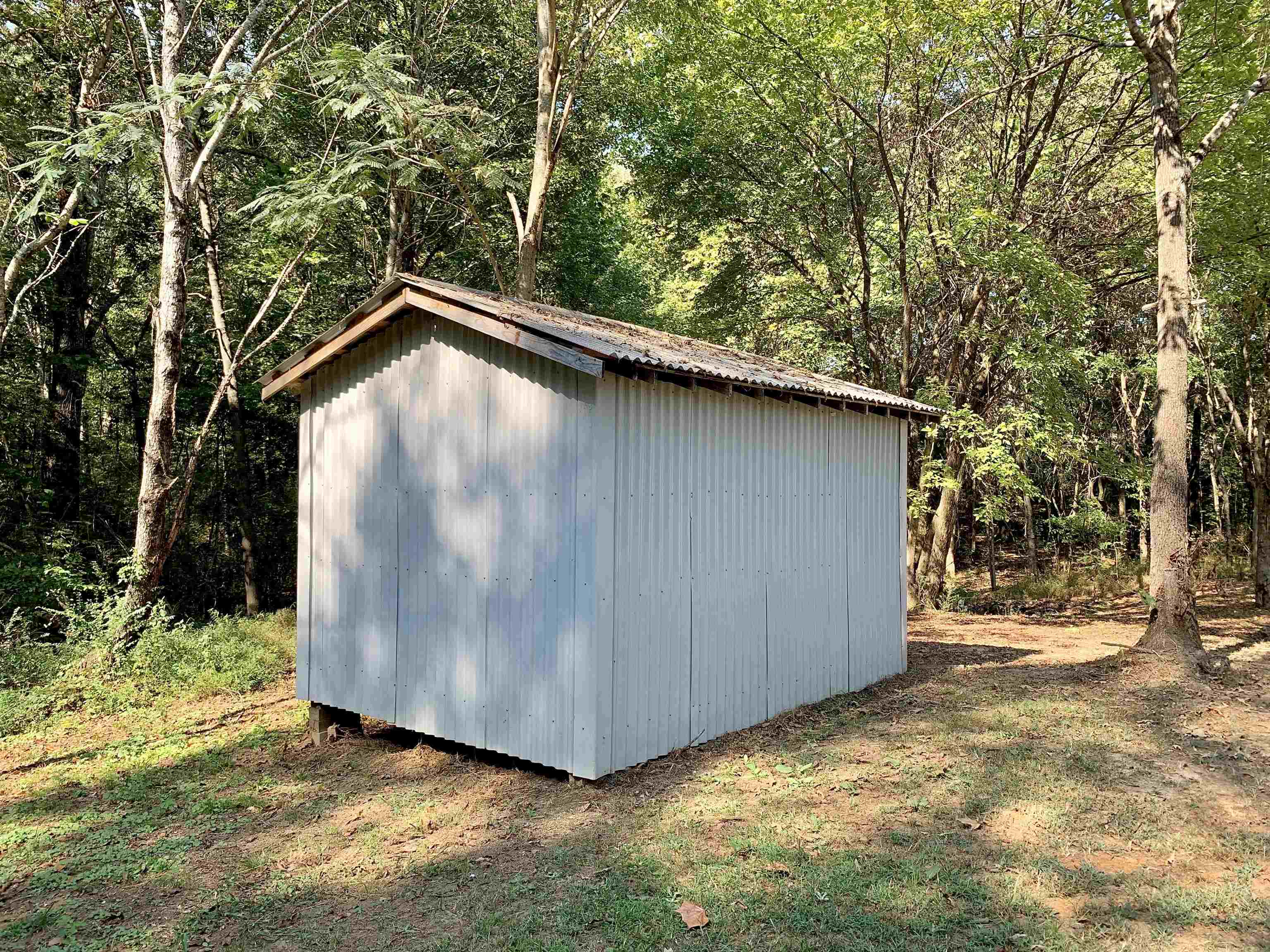 17 Cr 747 Road Walnut, MS 38683 - Photo 33 of 35 a backyard of a house with wooden fence and trees