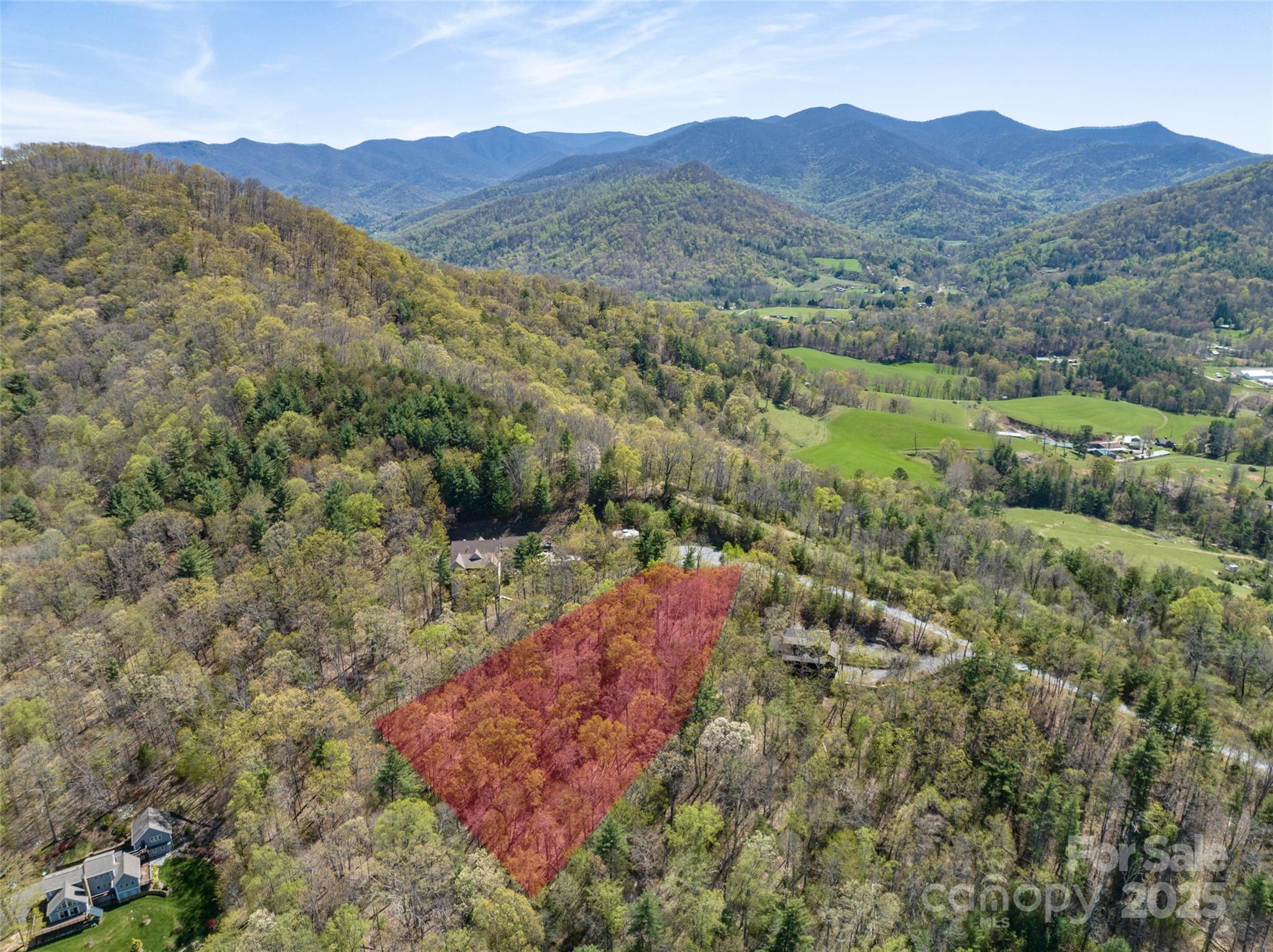 88 Courseview Drive, Unit 239 Weaverville, NC 28787 - Photo 5 of 16 a view of a lush green hillside and houses