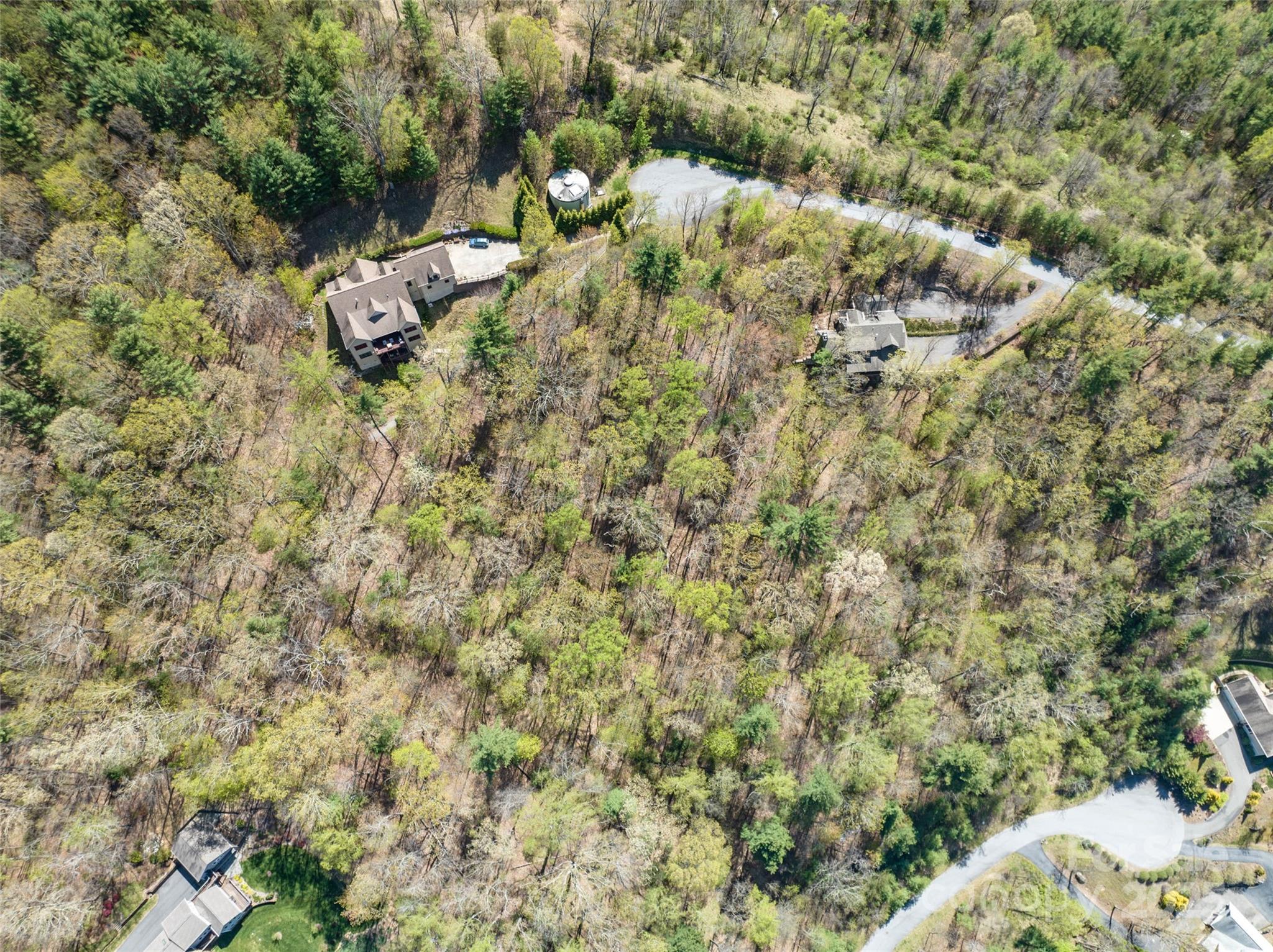 88 Courseview Drive, Unit 239 Weaverville, NC 28787 - Photo 8 of 16 a backyard of a house with a yard and outdoor seating