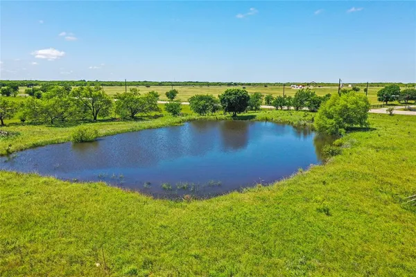a view of a lake with a yard