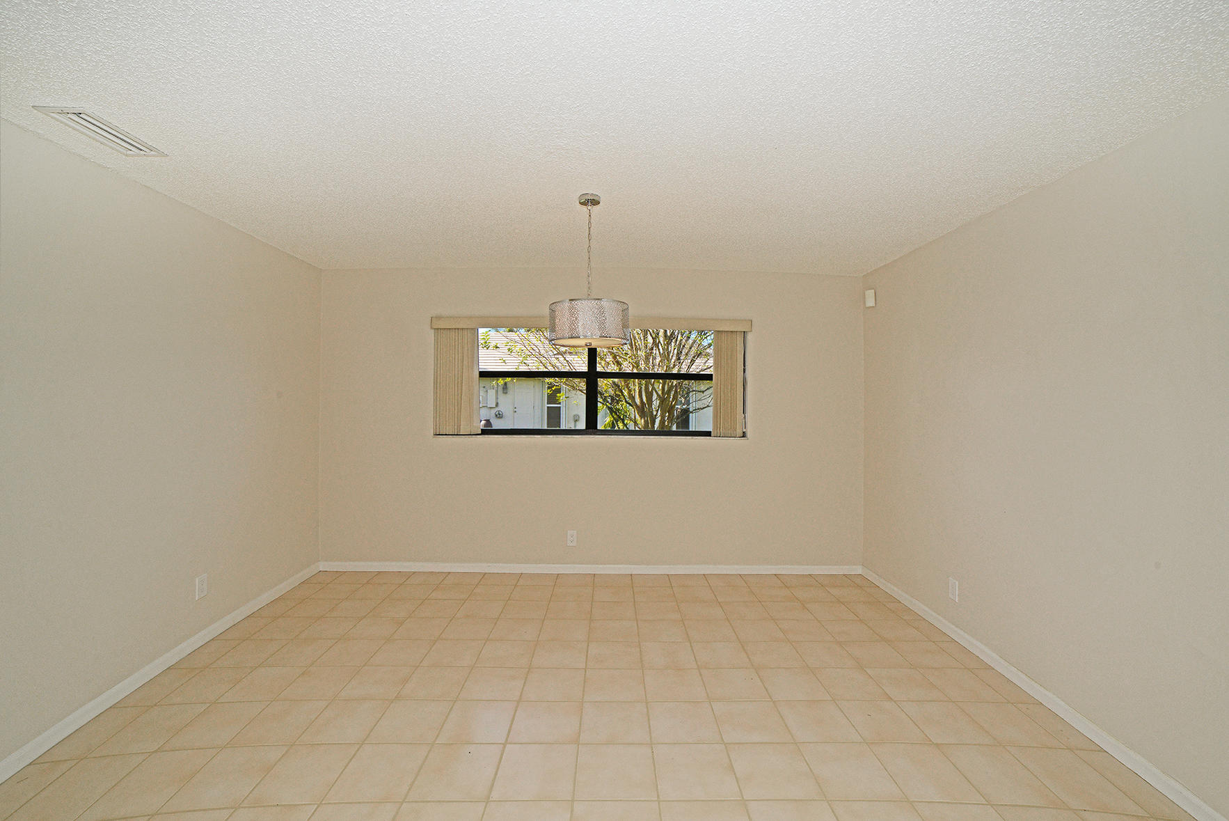 9053 Old Pine Road Boca Raton, FL 33428 - Photo 19 of 42 an empty room with a window