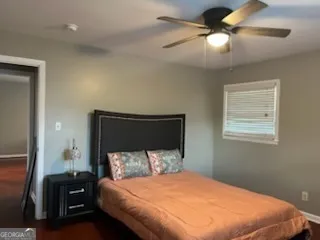 a bedroom with a bed and a mirror