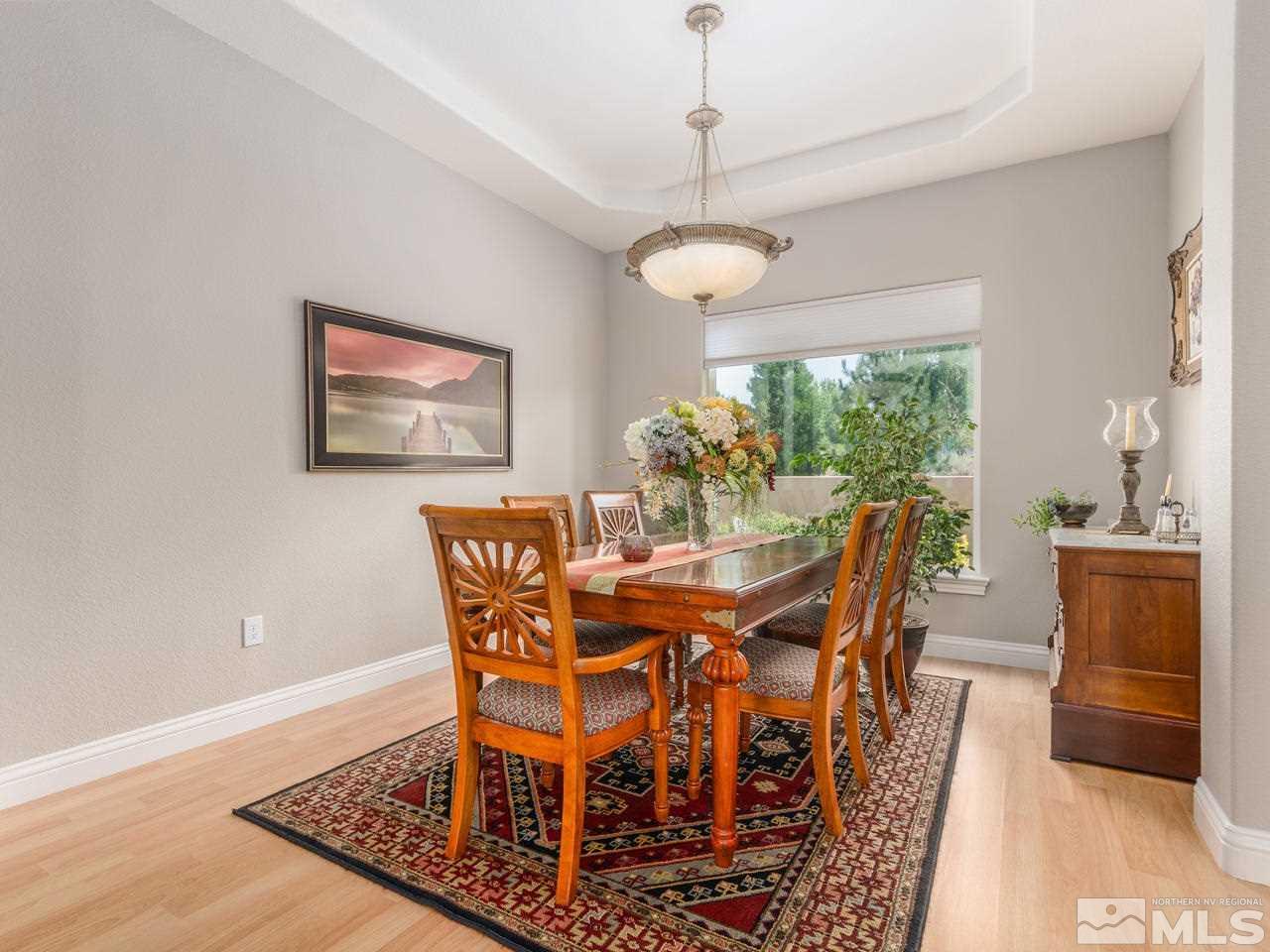 12615 Thomas Creek Road Reno, NV 89511 - Photo 6 of 25 a view of a dining room with furniture window and wooden floor