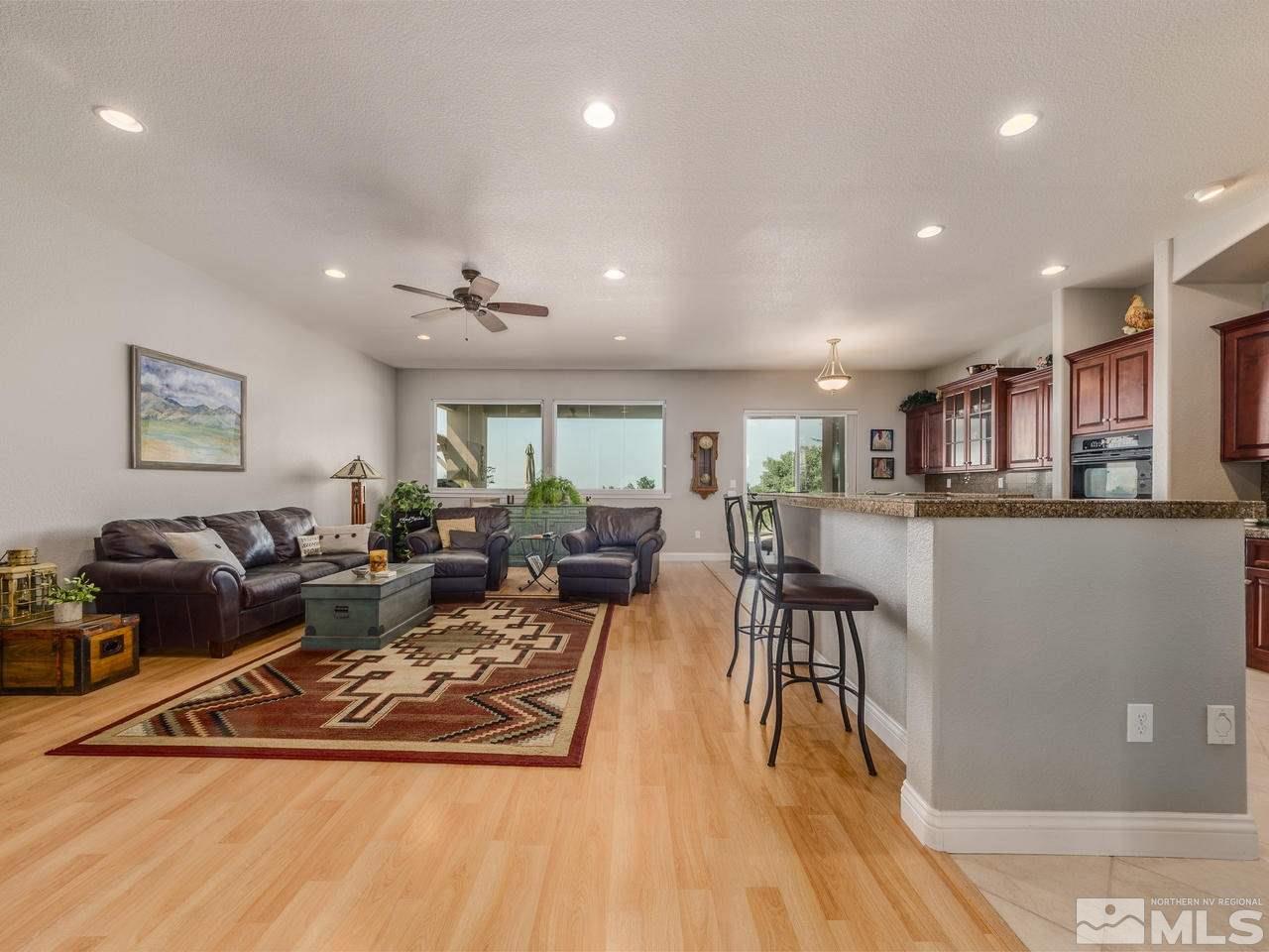 12615 Thomas Creek Road Reno, NV 89511 - Photo 9 of 25 a living room with lots of furniture and kitchen view
