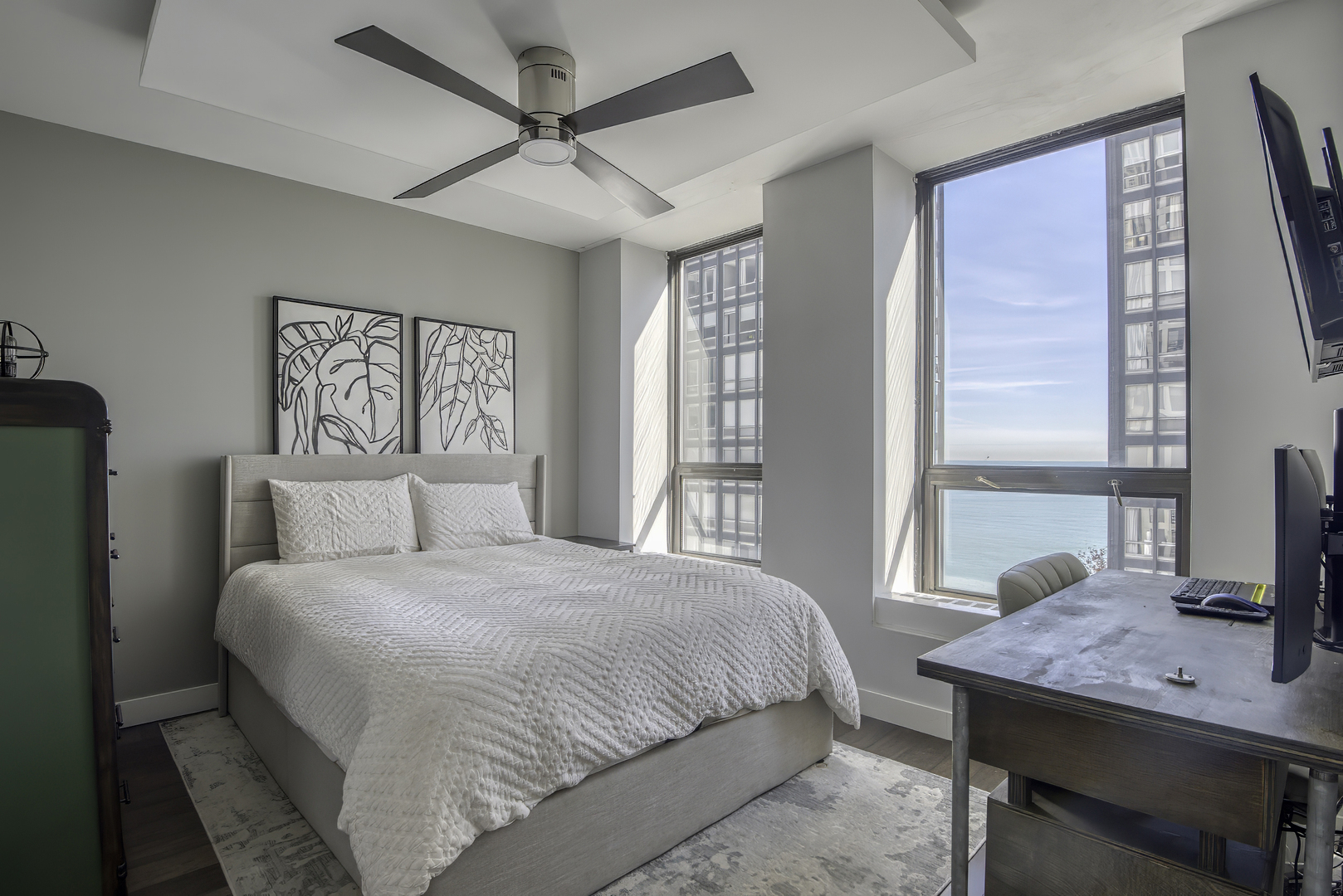 260 East Chestnut Street, Unit 1111 Chicago, IL 60611 - Photo 16 of 29 a bedroom with a bed window and a table