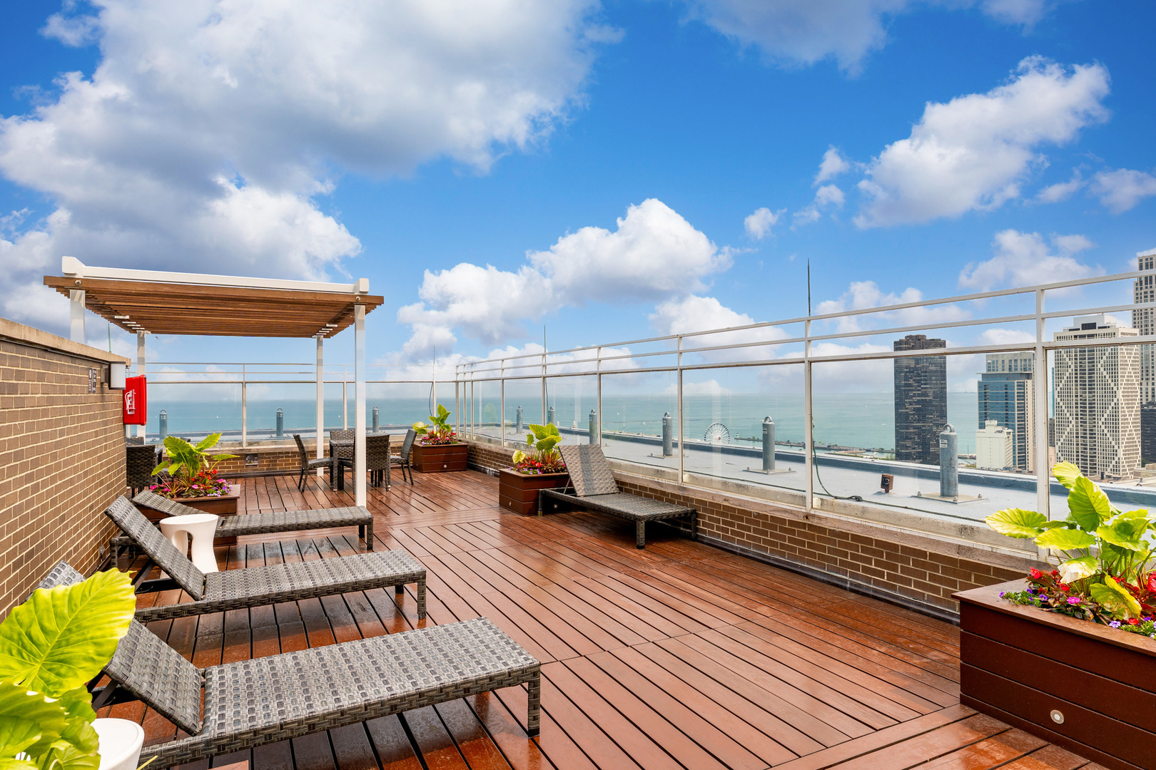 260 East Chestnut Street, Unit 1111 Chicago, IL 60611 - Photo 20 of 29 a roof deck with table and chairs