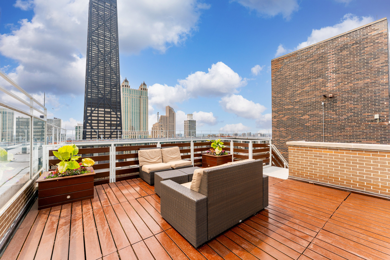 260 East Chestnut Street, Unit 1111 Chicago, IL 60611 - Photo 21 of 29 a view of roof deck with seating space and wooden floor