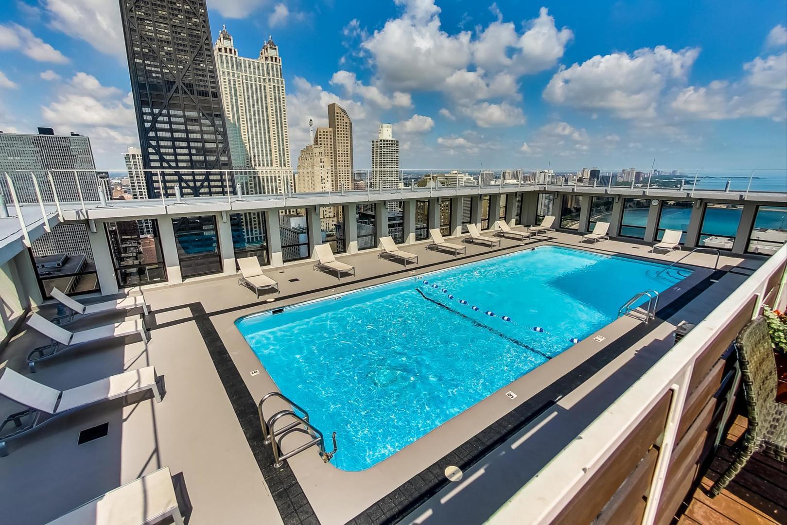 260 East Chestnut Street, Unit 1111 Chicago, IL 60611 - Photo 22 of 29 a view of swimming pool with outdoor seating
