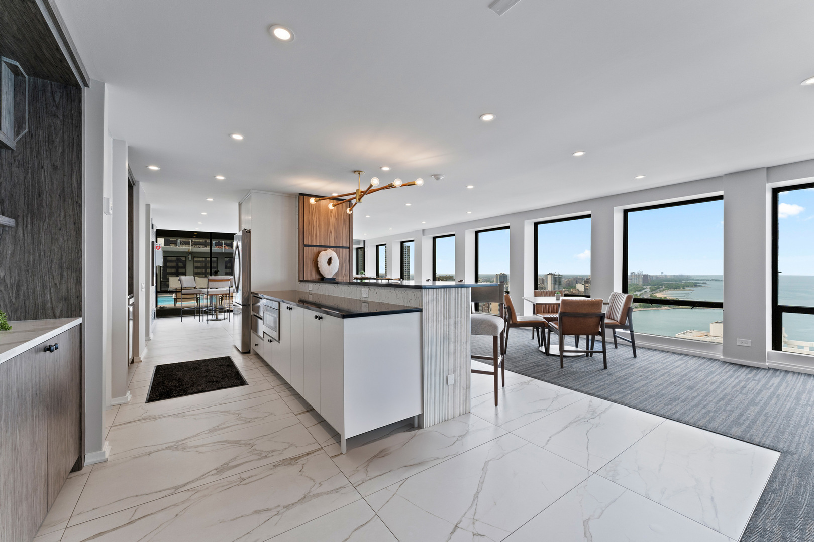 260 East Chestnut Street, Unit 1111 Chicago, IL 60611 - Photo 24 of 29 a kitchen with furniture and a refrigerator