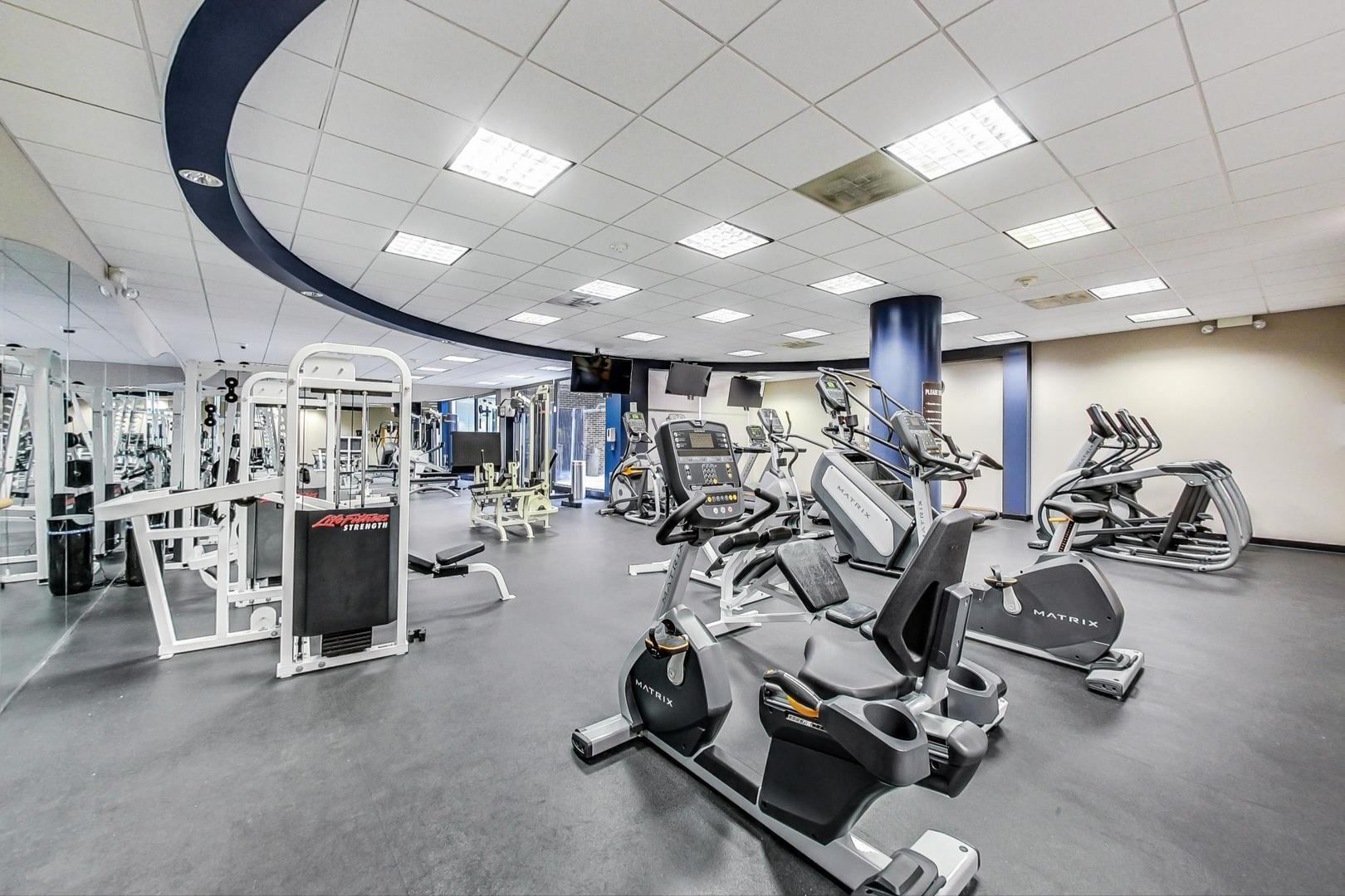 260 East Chestnut Street, Unit 1111 Chicago, IL 60611 - Photo 28 of 29 a view of a room with gym equipment