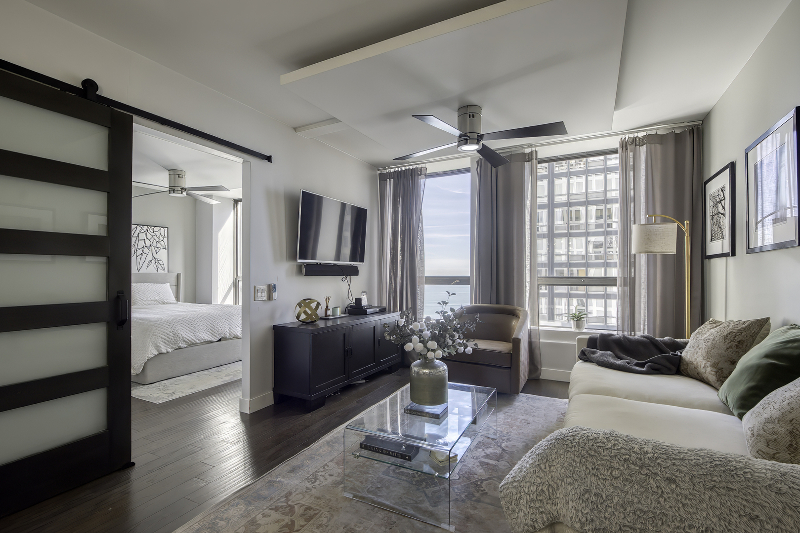 260 East Chestnut Street, Unit 1111 Chicago, IL 60611 - Photo 6 of 29 a living room with furniture and a large window