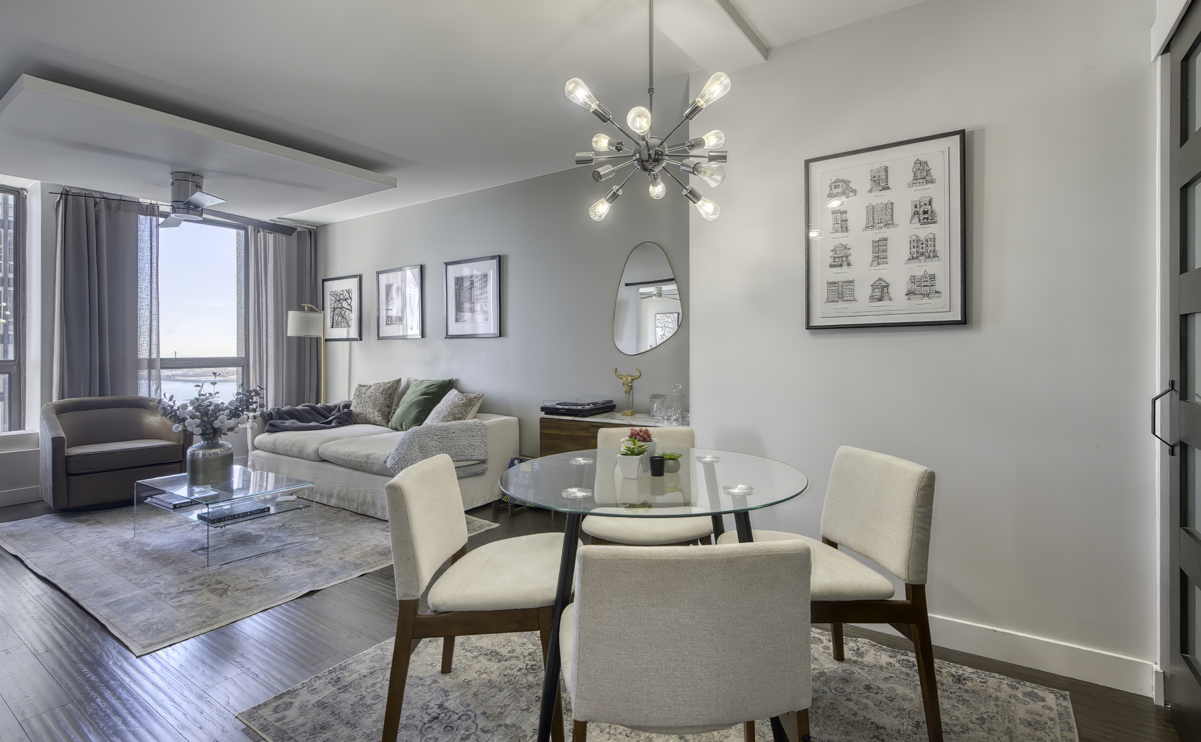 260 East Chestnut Street, Unit 1111 Chicago, IL 60611 - Photo 10 of 29 a living room with furniture and a large window