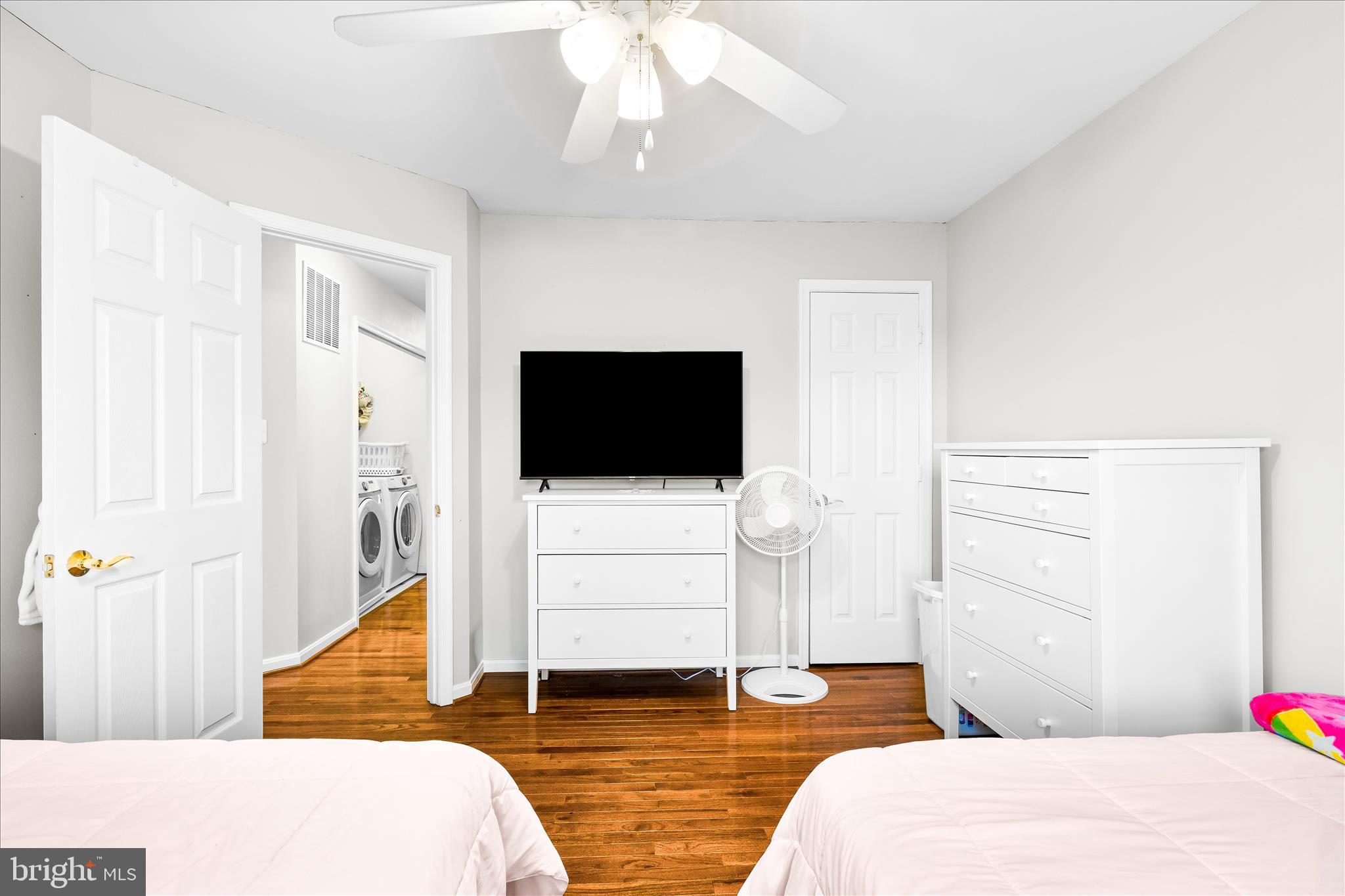 2442 Rippling Brook Road Frederick, MD 21701 - Photo 43 of 85 a bedroom with a bed and a flat screen tv