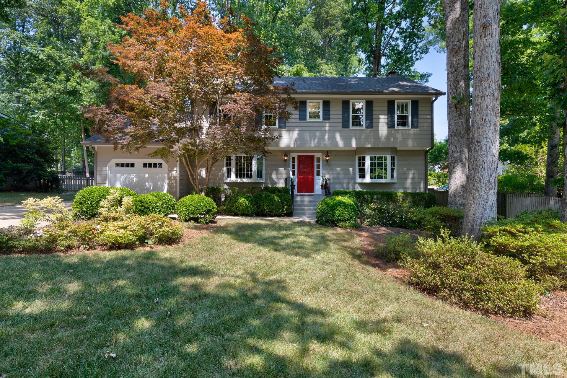 613 Ortega Road Raleigh, NC 27609 - Photo 1 of 37 a front view of a house with a yard and trees
