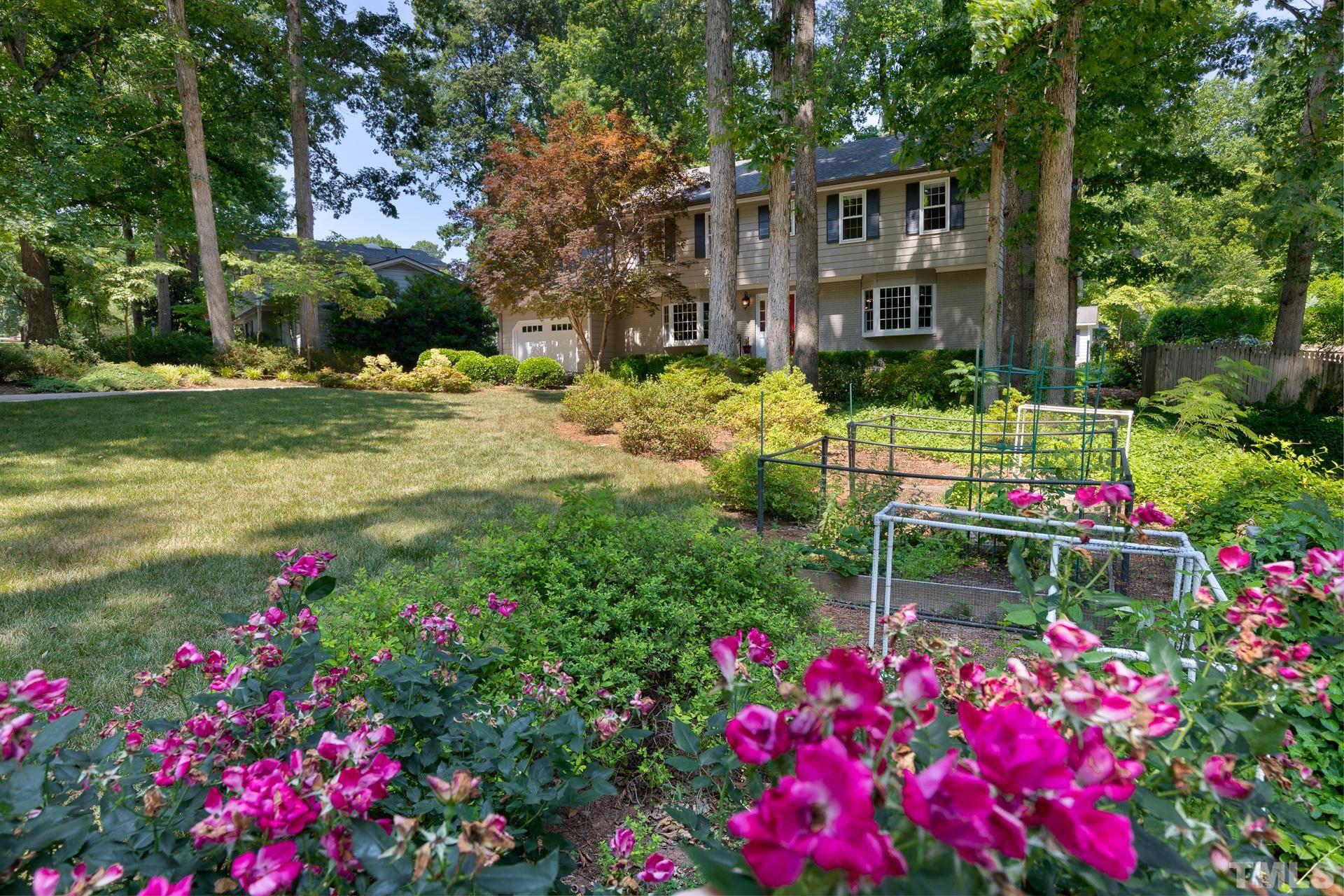 613 Ortega Road Raleigh, NC 27609 - Photo 32 of 37 a view of flower garden with a building in the background