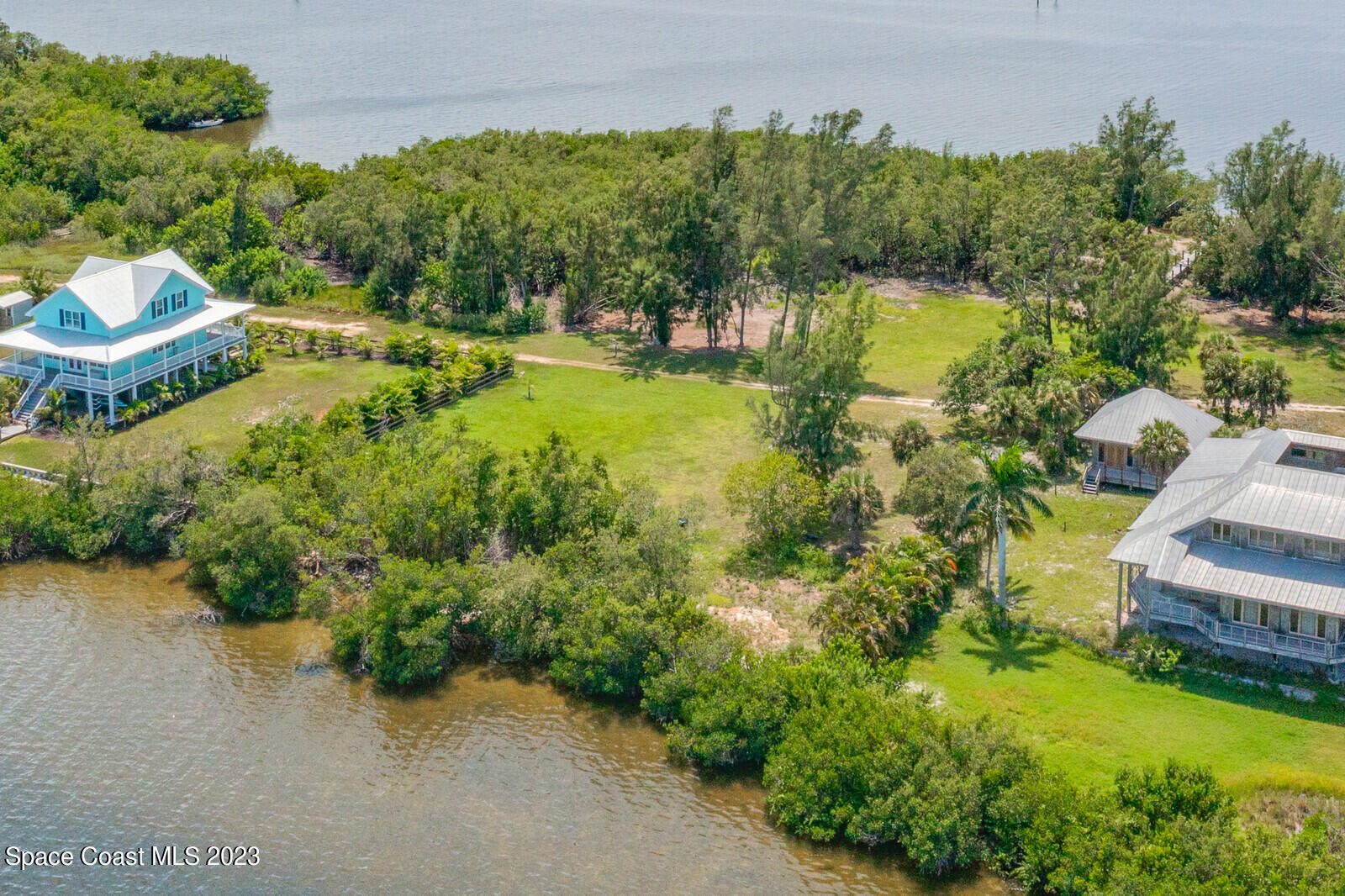 2 Grant Island Estates Grant, FL 32949 - Photo 12 of 13 an aerial view of a house with a yard and lake view