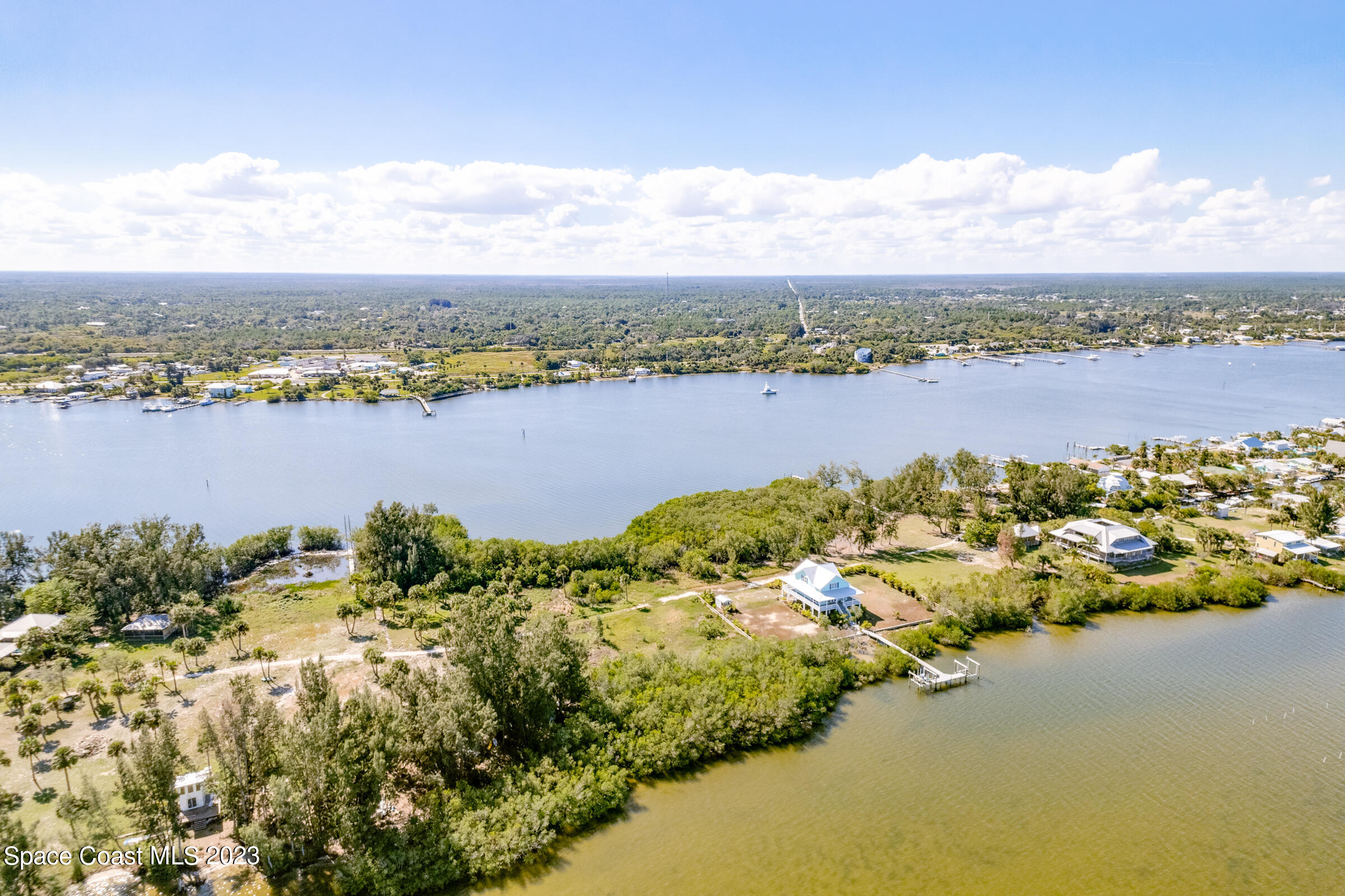 2 Grant Island Estates Grant, FL 32949 - Photo 6 of 13 a view of a lake with houses in the back