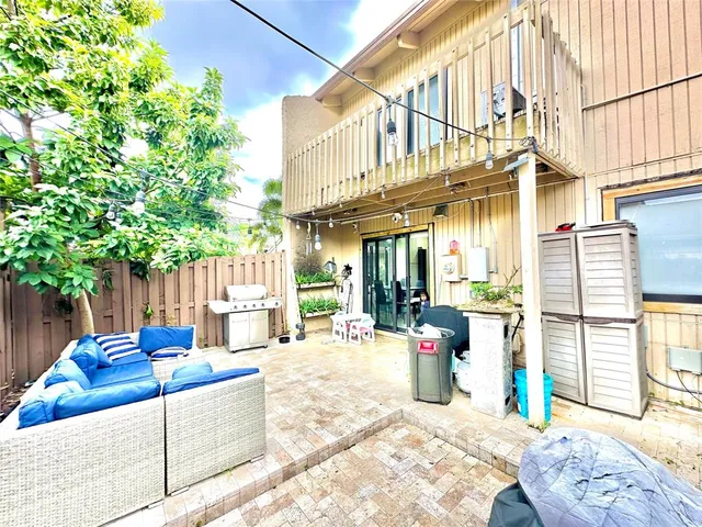 a view of outdoor space with wooden floor and windows