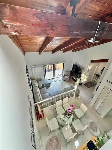 a view of living room with furniture and flowers