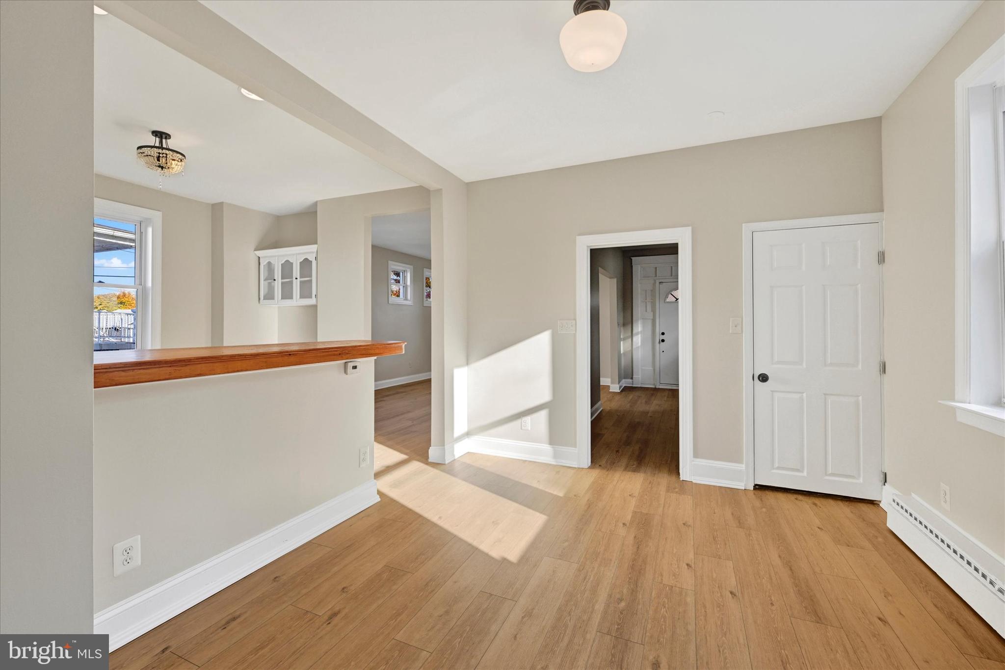 3113 California Avenue Baltimore, MD 21234 - Photo 15 of 29 a view of a big room with wooden floor and windows