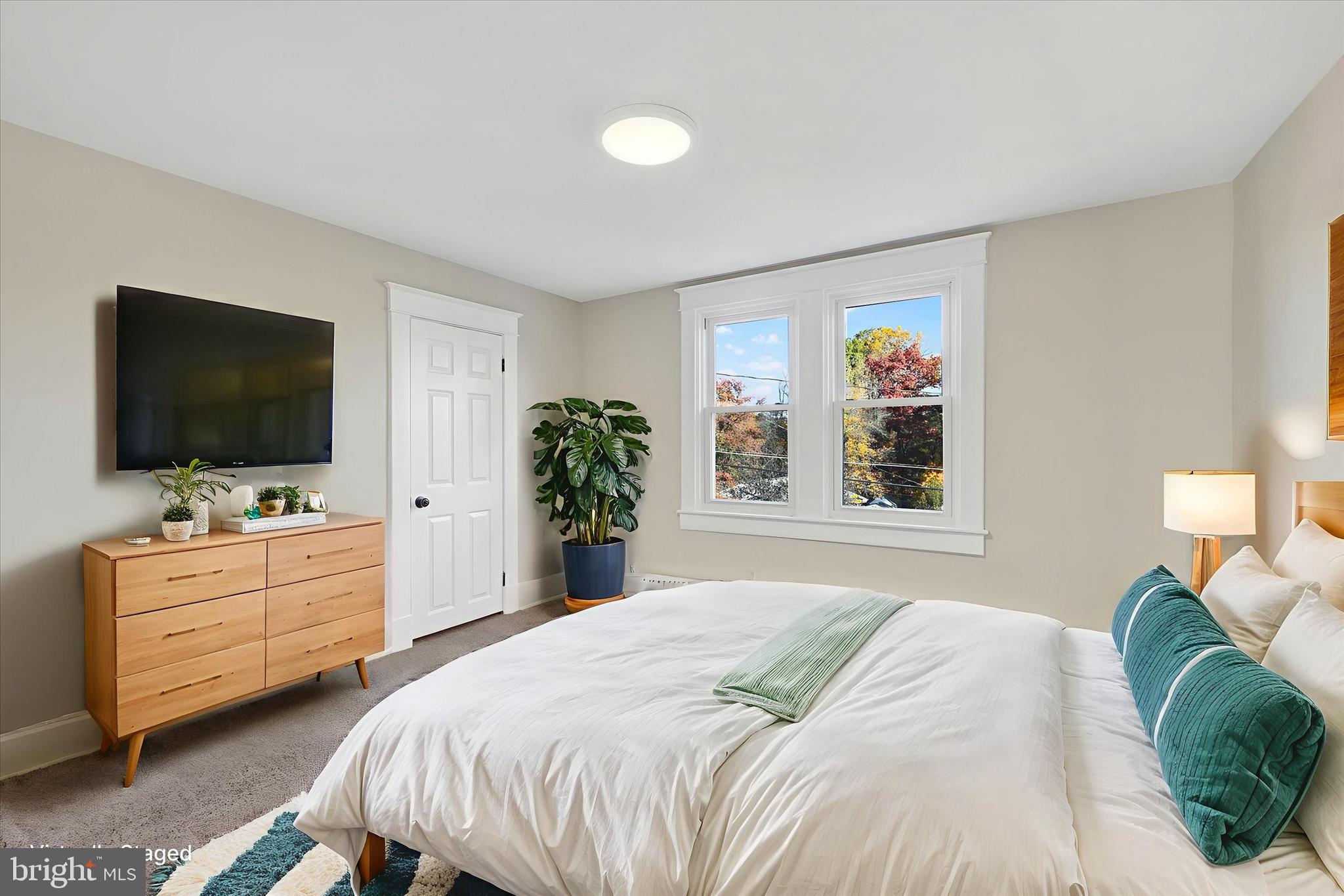 3113 California Avenue Baltimore, MD 21234 - Photo 17 of 29 a bedroom with a bed and a flat screen tv