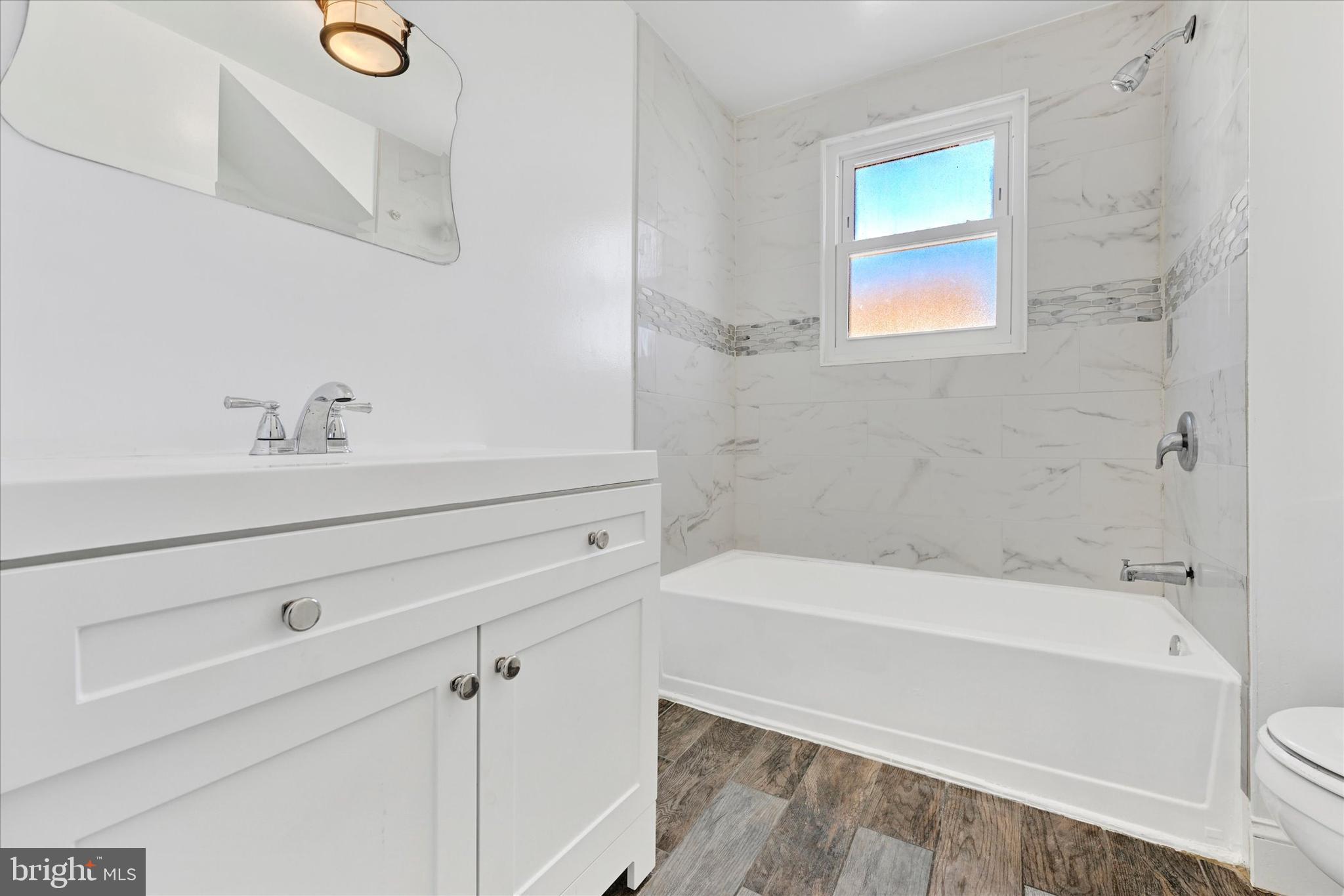 3113 California Avenue Baltimore, MD 21234 - Photo 21 of 29 a bathroom with a bathtub and a sink