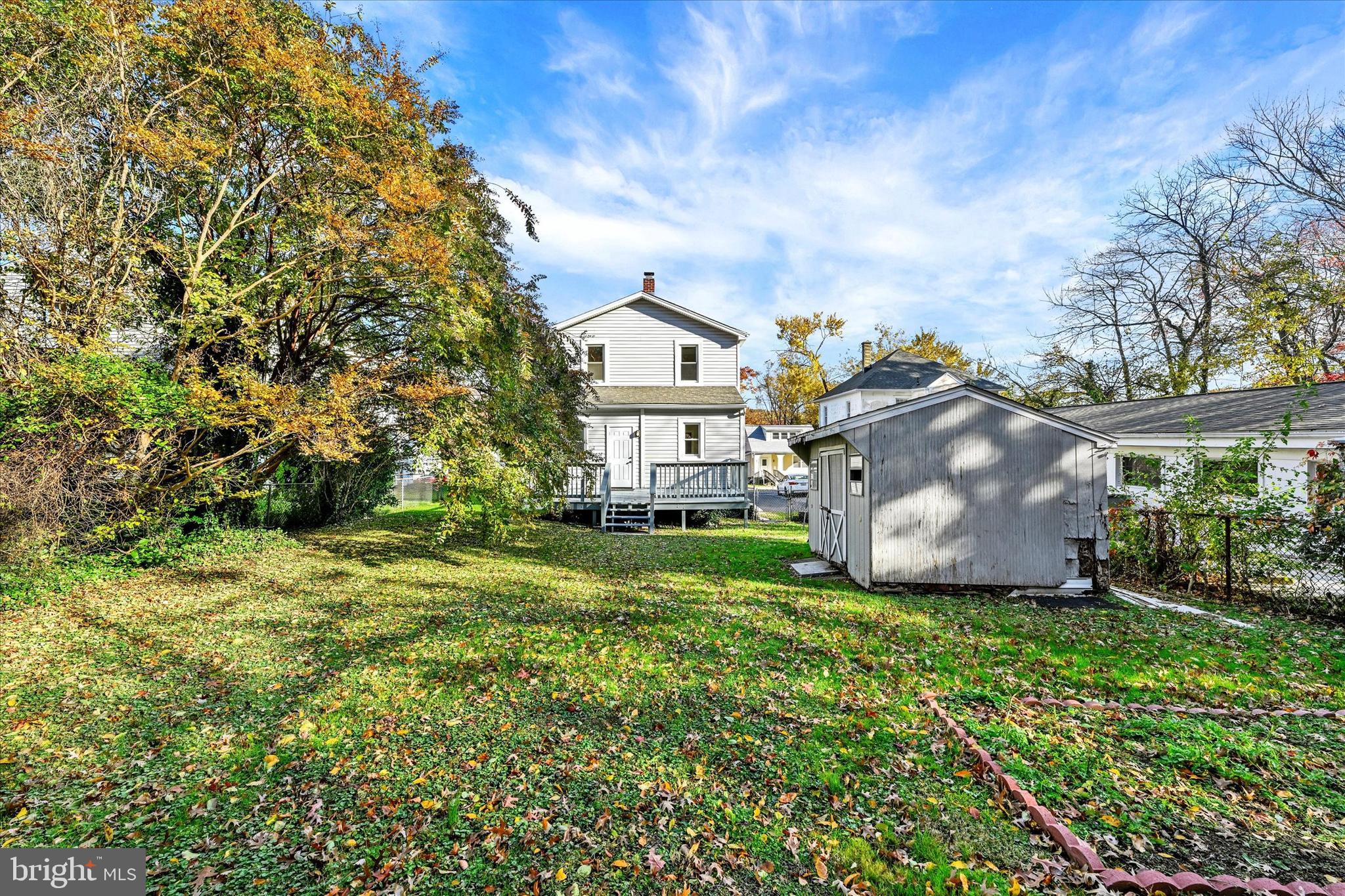 3113 California Avenue Baltimore, MD 21234 - Photo 26 of 29 a view of a big house with a big yard and large trees
