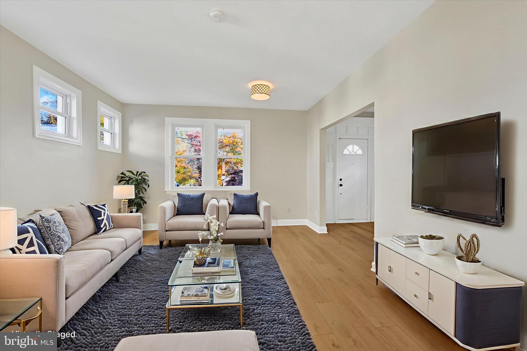 3113 California Avenue Baltimore, MD 21234 - Photo 3 of 29 a living room with furniture and a flat screen tv
