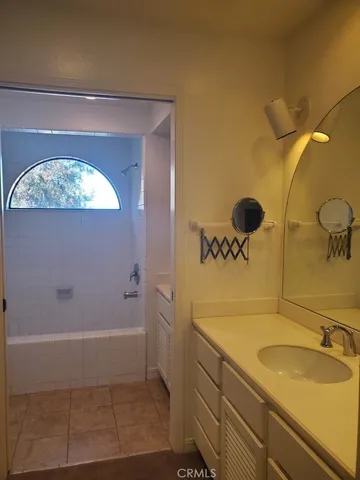 a bathroom with a sink and mirror