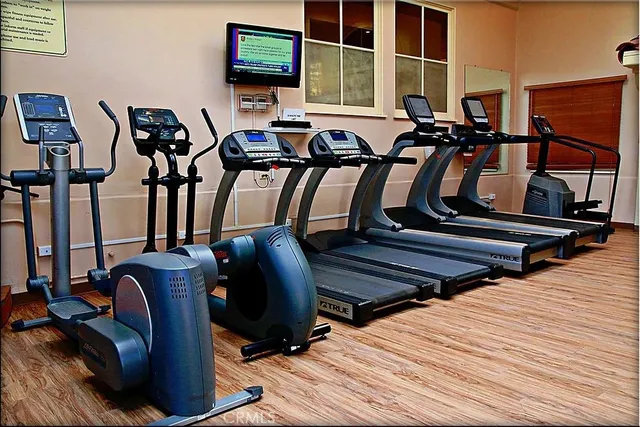 an aerial view of a swimming pool with outdoor seating