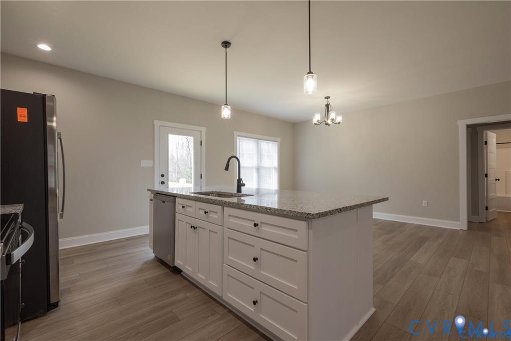 2223 Ridge Road Arvonia, VA 23004 - Photo 16 of 32 Kitchen island featuring a granite countertop, und