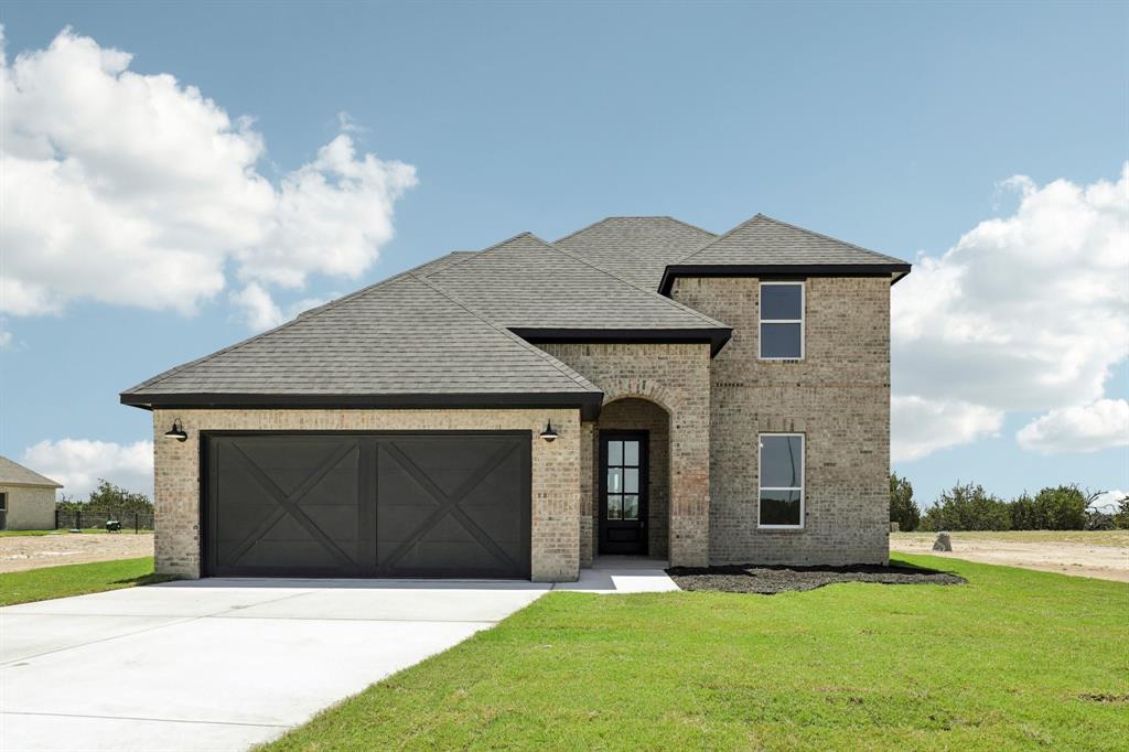 2017 Redemption Drive Weatherford, TX 76088 - Photo 1 of 1 View of front of home with a garage and a front lawn