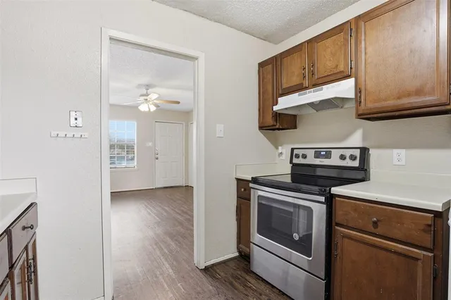 a kitchen with a stove and a microwave