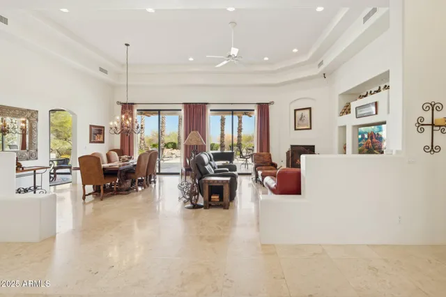 a living room with furniture a rug and a window