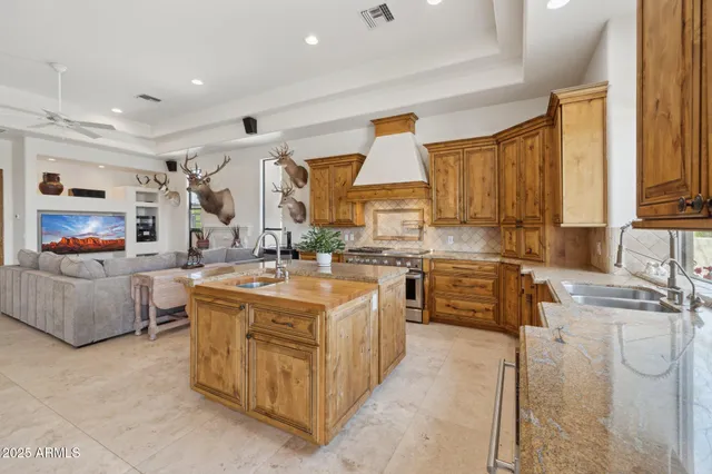 a stove top oven sitting inside of a kitchen