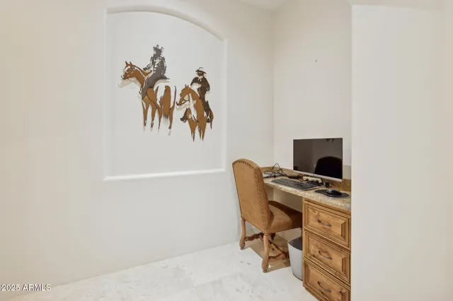 a view of a swimming pool and chairs