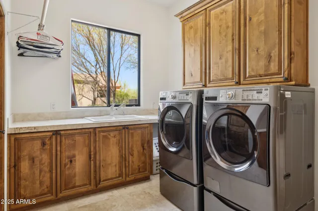 a view of a house with swimming pool and a chairs