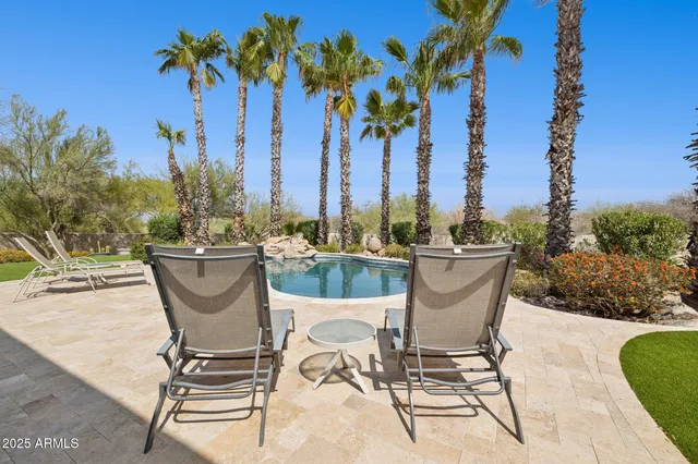 an aerial view of residential building with green space